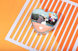 Heart-shaped sublimation blank tin box with custom photo and text, ideal for laser engraving.
