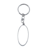 Blank oval metal keyring for sublimation printing or laser engraving on white background