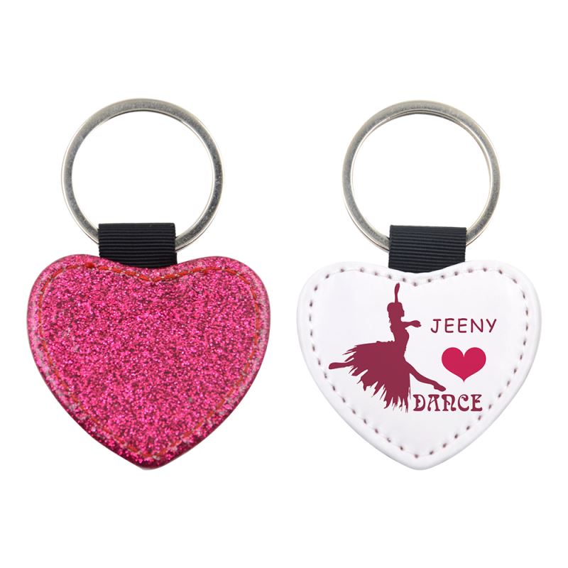 Heart-shaped sublimation blank keyrings, one with pink glitter, one customizable for laser engraving.