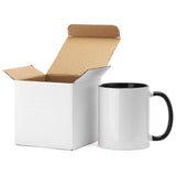 11oz white sublimation mug with black inner and handle, next to open cardboard box