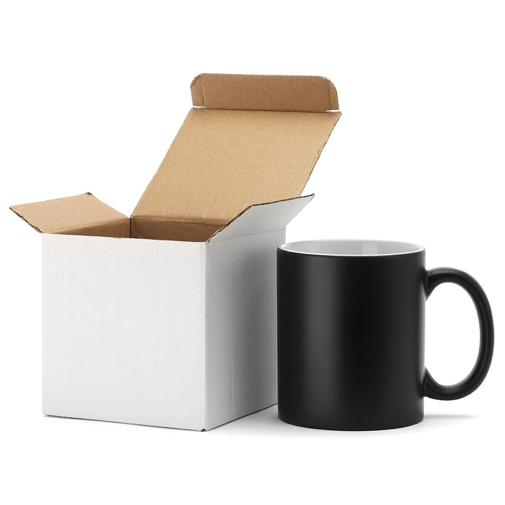 Matte black 11oz sublimation mug with open white cardboard box, blank for printing or engraving