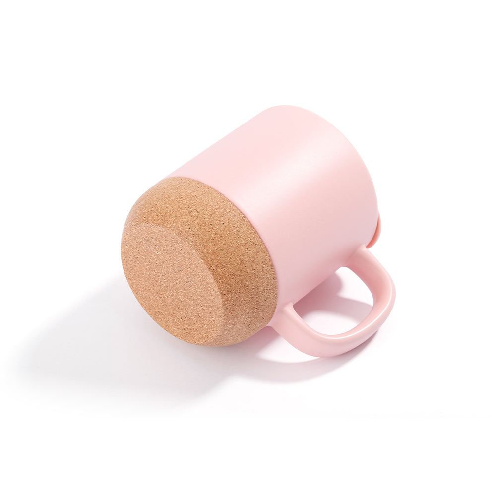 Bottom view of matte pink 13oz sublimation mug with detachable cork base, emphasizing non-slip and heat-resistant features for daily use.