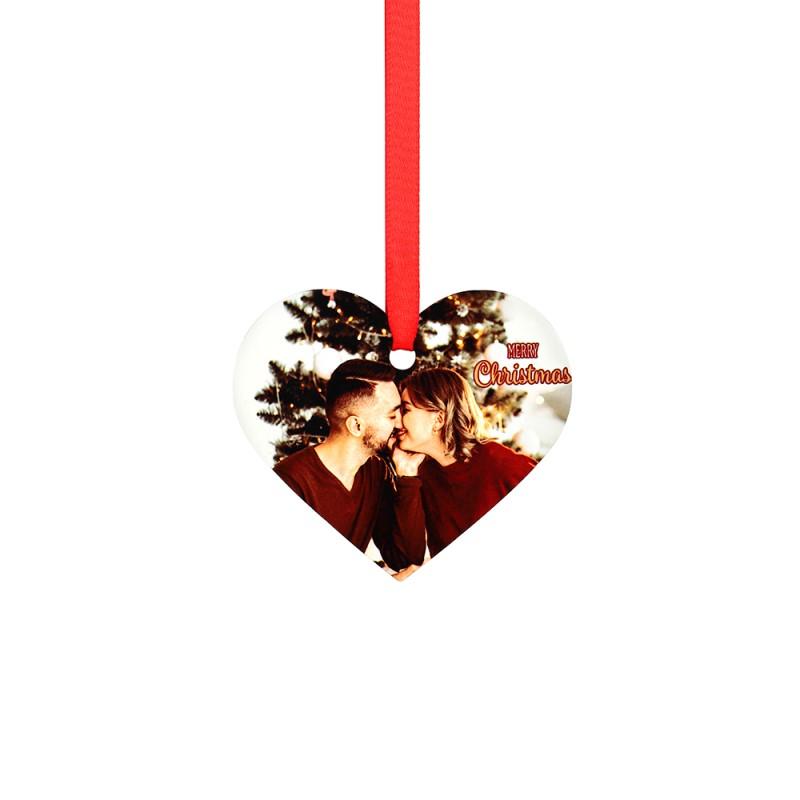 Heart-shaped sublimation blank Christmas ornament with photo, red ribbon, and festive text.