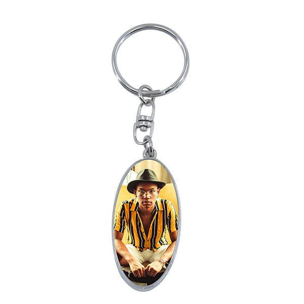 Oval sublimation blank keyring with inserted custom photo, ideal for personalized laser engraving