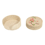 Blank jute coasters with holder, one coaster features floral sublimation print, for engraving or crafting.