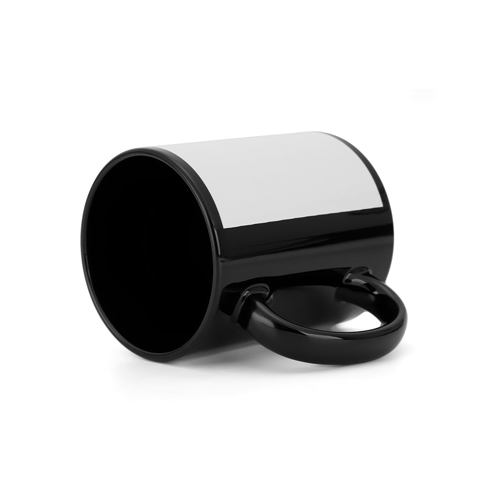 Black sublimation blank mug with white printable panel for laser engraving, lying on its side