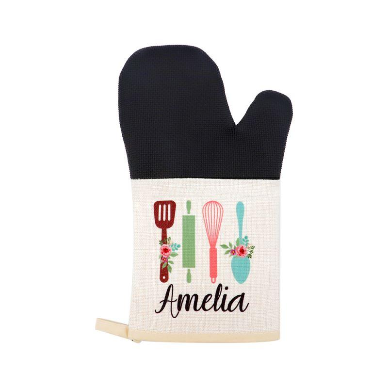 Personalised sublimation oven glove with black top, floral kitchen utensils and custom text.