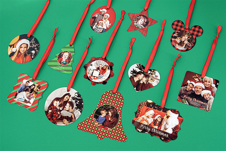 Double-sided aluminium Christmas decorations with custom photo sublimation and red ribbons on green background