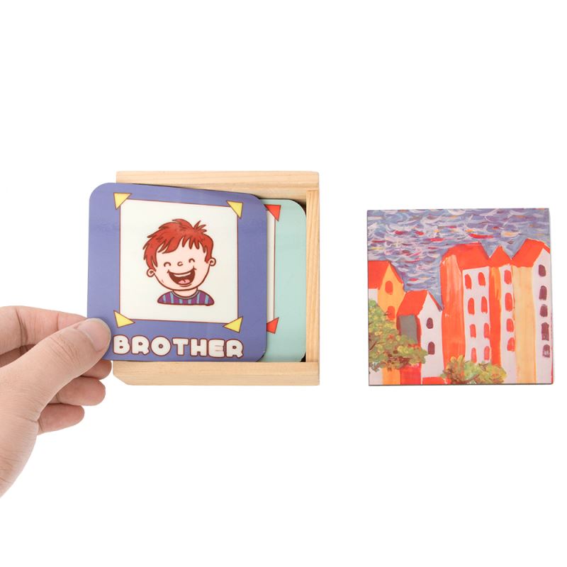 Hand holding sublimation coaster with cartoon design, wooden gift box, sublimation blanks