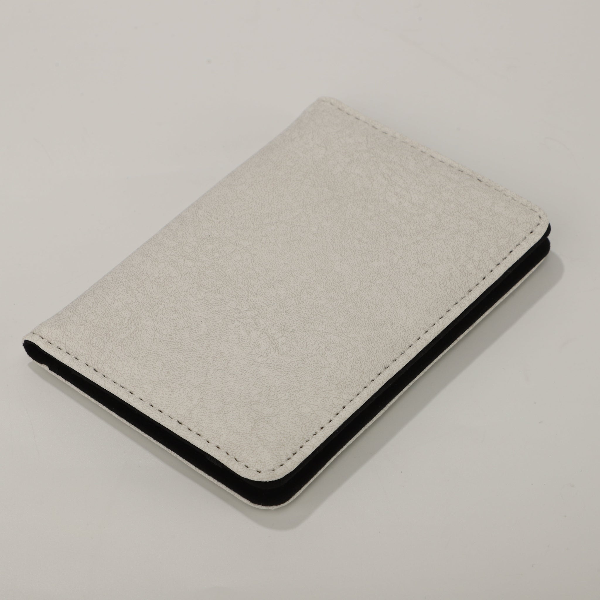 Sublimation Blank Poly PU Passport Cover - White with elegant texture, ideal for custom printing and waterproof travel use.