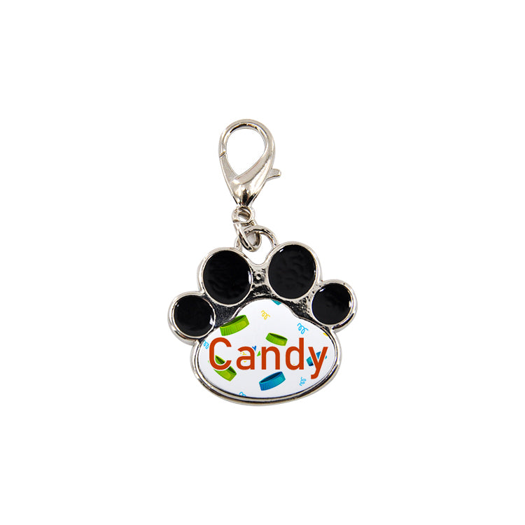 Paw print pet tag for sublimation, metal, black enamel, with 'Candy' text and lobster clasp.